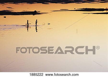 Two Boys Walking Along The Mekong River Bank At Sunset View Large Photo Image Stock Image - Two Boys Walking Along The Mekong River Bank At Sunset. Fotosearch