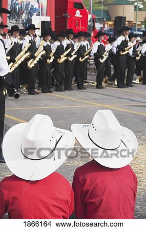 Two Boys Watching Marching Band, Calgary, Alberta, Canada View Large Photo Image Picture - Two Boys Watching Marching Band, Calgary, Alberta, Canada. Fotosearch