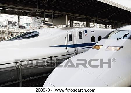 Stock Photo - Two Bullet Train Trains Side By Side In The Station; Tokyo, Japan. Fotosearch