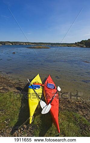 Stock Photography - Two Canoes On Flaton Island Shore, Bohuslan Archipelago, Sweden. Fotosearch