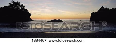 Two Cliffs Lining Beach At Sunset View Large Photo Image Stock Photo - Two Cliffs Lining Beach At Sunset. Fotosearch