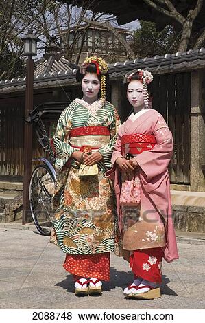 Stock Photo - Two Geishas In Old Kyoto; Kyoto, Japan. Fotosearch