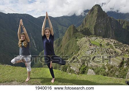 Two Girls Doing A Pirouette On A Cliff Overlooking Machu Picchu; Peru View Large Photo Image Stock Photograph - Two Girls Doing A Pirouette On A Cliff Overlooking Machu Picchu; Peru. Fotosearch