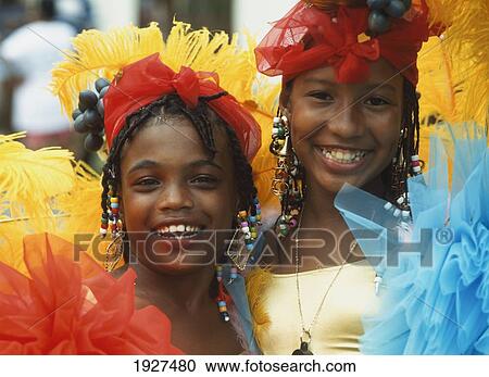 Stock Image - Two Girls In Traditional Dress, Carnival. Fotosearch