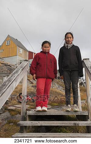 Stock Image - Two Inuit Girls; Kangaamiut, Greenland. Fotosearch