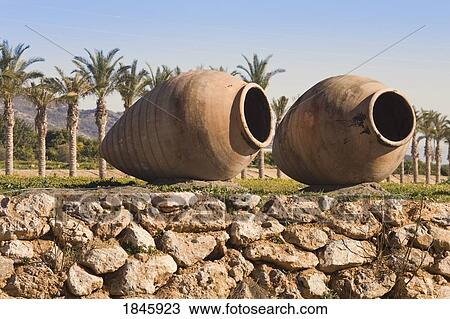 Stock Image - Two Large Urns Decorating A Garden; Coin, Malaga Province, Spain. Fotosearch