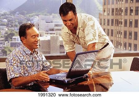 Stock Image - Two Local Businessman Viewing Computer Screen. Fotosearch