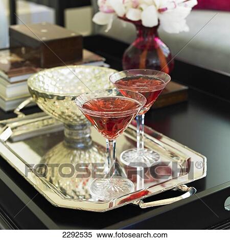 Stock Photography - Two martini glasses on a silver tray; Victoria vancouver island british columbia canada. Fotosearch