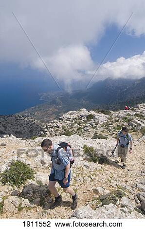 Two Men Hiking Along Mountain Trail, Elevated View, Majorca, Balearic Islands, Spain, Track Built By Archduke Ludwig Salvador View Large Photo Image Stock Image - Two Men Hiking Along Mountain Trail, Elevated View, Majorca, Balearic Islands, Spain, Track Built By Archduke Ludwig Salvador. Fotosearch