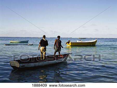 Stock Photo - Two Men On Boat, Rear View. Fotosearch