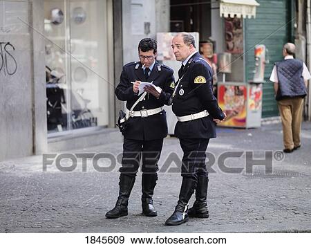 Two Middle-Aged Policemen On Street; Naples, Italy View Large Photo Image Stock Photo - Two Middle-Aged Policemen On Street; Naples, Italy. Fotosearch