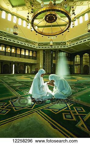 Two Muslim woman in Brunei Mosque; Bandar Seri Begawan, Brunei View Large Photo Image Stock Photograph - Two Muslim woman in Brunei Mosque; Bandar Seri Begawan, Brunei. Fotosearch