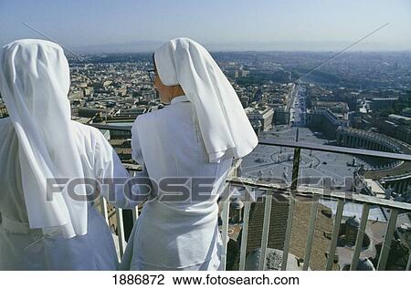 Two Nuns Looking Over St Peters Square In The Vatican View Large Photo Image Stock Image - Two Nuns Looking Over St Peters Square In The Vatican. Fotosearch