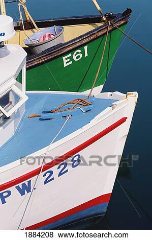Stock Photo - Two Painted Fishing Boats In Harbour, Close Up. Fotosearch