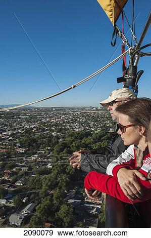 Two People Hot-Air Ballooning In Albuquerque, New Mexico, Usa View Large Photo Image Stock Photo - Two People Hot-Air Ballooning In Albuquerque, New Mexico, Usa. Fotosearch
