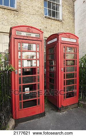 Stock Image - Two Red Phone Booths Side By Side; Salisbury England. Fotosearch