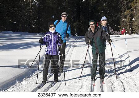 Stock Photo - Two Sets Of Cross Country Skiier Couples On Tracked Trail; Lake Louise, Alberta, Canada. Fotosearch