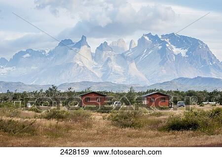 Two small red cabins in front of rugged mountains; Torres del Pain, Chile View Large Photo Image Stock Photo - Two small red cabins in front of rugged mountains; Torres del Pain, Chile. Fotosearch