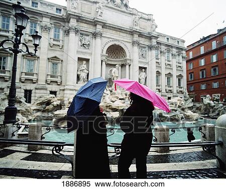 Two Tourists At Trevi Fountain With Umbrellas View Large Photo Image Stock Photography - Two Tourists At Trevi Fountain With Umbrellas. Fotosearch