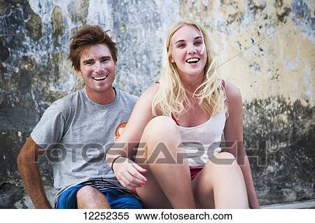 Two tourists hanging out in a back alley of Georgetown; Penang, Malaysia View Large Photo Image Stock Photography - Two tourists hanging out in a back alley of Georgetown; Penang, Malaysia. Fotosearch