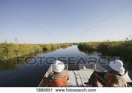 Two Tourists Taking A Boat Trip On Kwando River View Large Photo Image Stock Image - Two Tourists Taking A Boat Trip On Kwando River. Fotosearch