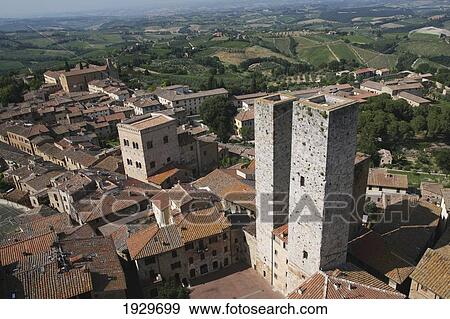 Stock Photo - Two towers in the centre of San Gimignano, a famous medieval hilltop town; San Gimignano, Tuscany, Italy. Fotosearch