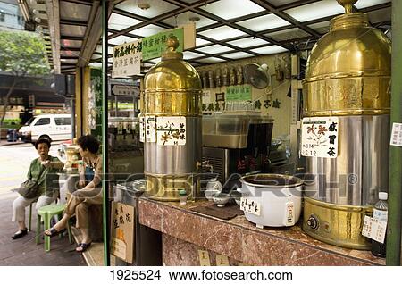 Picture - Two Women Sitting By Street Food Stall. Fotosearch