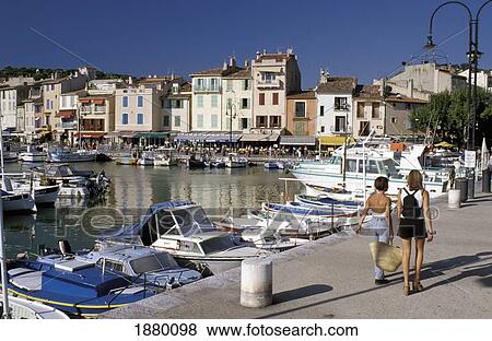 Two Women Walking Along The Harbor At Cassis View Large Photo Image Stock Photo - Two Women Walking Along The Harbor At Cassis. Fotosearch