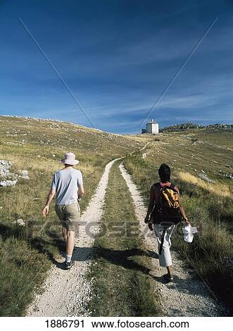 Two Women Walking Along Track To The Chapel Of St Maria Delle Pieta View Large Photo Image Stock Image - Two Women Walking Along Track To The Chapel Of St Maria Delle Pieta. Fotosearch