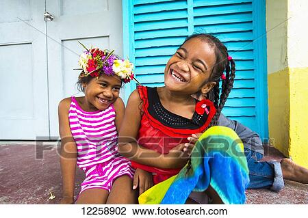 Two young girls laughing together; Tuvalu View Large Photo Image Stock Image - Two young girls laughing together; Tuvalu. Fotosearch