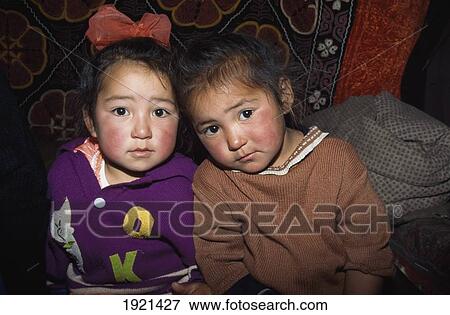 Two Young Girls á View Large Photo Image Stock Photo - Two Young Girls á. Fotosearch