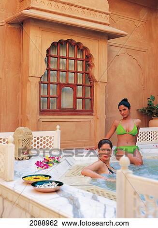 Two Young Women In A Jacuzzi In An Open Courtyard At The Spa At Oberoi Rajvilas; Jaipur Rajasthan India View Large Photo Image Stock Image - Two Young Women In A Jacuzzi In An Open Courtyard At The Spa At Oberoi Rajvilas; Jaipur Rajasthan India. Fotosearch