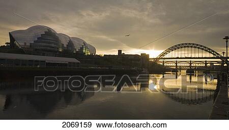 Stock Photo - Tyne Bridge Over River Tyne At Sunset; Newcastle Upon Tyne Tyne And Wear England. Fotosearch