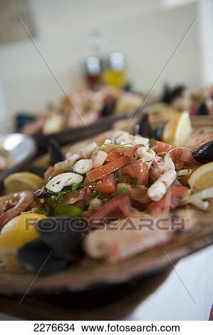 Typical seafood salad served at Restaurant Haroun, fishing port La Marsa; Houmt Souk, Djerba, Tunisia View Large Photo Image Picture - Typical seafood salad served at Restaurant Haroun, fishing port La Marsa; Houmt Souk, Djerba, Tunisia. Fotosearch