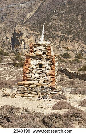 Stock Photo - Typical Stone Chorten (Stupa); Gyakar, Upper Mustang Valley, Nepal. Fotosearch