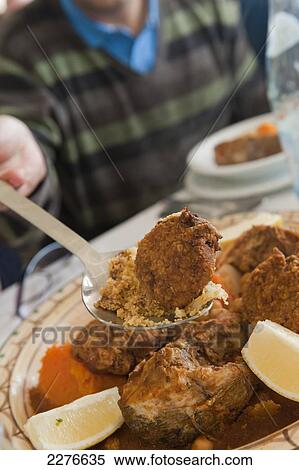 Typical Tunisian meat dish served at Restaurant Haroun, fishing port La Marsa; Houmt Souk, Djerba, Tunisia View Large Photo Image Stock Photography - Typical Tunisian meat dish served at Restaurant Haroun, fishing port La Marsa; Houmt Souk, Djerba, Tunisia. Fotosearch