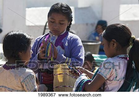 Stock Photo - Tzotzil Maya Girls In The Courtyard Of The San Juan Church, San Juan Chamula, Chiapas, Mexico. Fotosearch