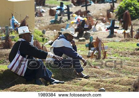 Tzotzil Maya Men Sitting On A Grave In The Cemetery Of San Juan Chamula, Chiapas, Mexico View Large Photo Image Picture - Tzotzil Maya Men Sitting On A Grave In The Cemetery Of San Juan Chamula, Chiapas, Mexico. Fotosearch
