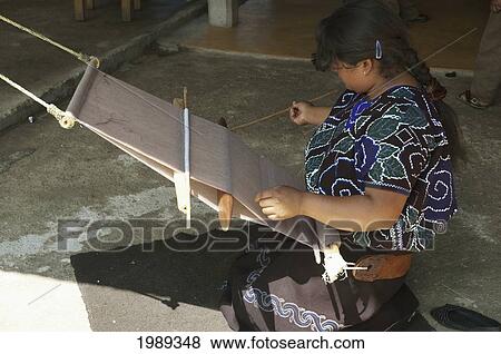 Stock Photo - Tzotzil Maya Woman Weaving At Her Loom, Zinacantan, Chiapas, Mexico. Fotosearch