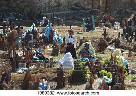 Tzotzil Maya Women And Children Visiting A Grave At The Cemetery Of San Juan Chamula, Chiapas, Mexico View Large Photo Image Stock Image - Tzotzil Maya Women And Children Visiting A Grave At The Cemetery Of San Juan Chamula, Chiapas, Mexico. Fotosearch