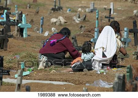 Tzotzil Maya Women And Children Visiting A Grave At The Cemetery Of San Juan Chamula, Chiapas, Mexico View Large Photo Image Stock Photo - Tzotzil Maya Women And Children Visiting A Grave At The Cemetery Of San Juan Chamula, Chiapas, Mexico. Fotosearch