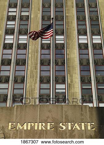 U. S. Flag In Front Of Empire State Building, Manhattan, New York, Usa View Large Photo Image Stock Photo - U. S. Flag In Front Of Empire State Building, Manhattan, New York, Usa. Fotosearch