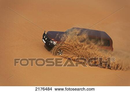 UAE, Abu Dhabi, Four wheel drive going through soft sand; Liwa View Large Photo Image Picture - UAE, Abu Dhabi, Four wheel drive going through soft sand; Liwa. Fotosearch