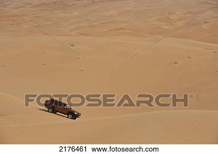UAE, Abu Dhabi, Four wheel drive going across sand dunes; Liwa View Large Photo Image Stock Image - UAE, Abu Dhabi, Four wheel drive going across sand dunes; Liwa. Fotosearch
