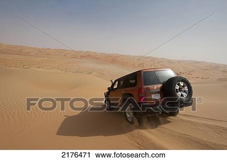 UAE, Abu Dhabi, Four wheel drive going across sand dunes; Liwa View Large Photo Image Stock Image - UAE, Abu Dhabi, Four wheel drive going across sand dunes; Liwa. Fotosearch