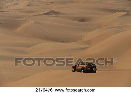 UAE, Abu Dhabi, Four wheel drive going across sand dunes; Liwa View Large Photo Image Stock Photograph - UAE, Abu Dhabi, Four wheel drive going across sand dunes; Liwa. Fotosearch