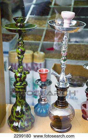 Stock Image - UAE, Al Raffa area of city centre; Dubai, Shop selling Hookah Pipes in front window. Fotosearch