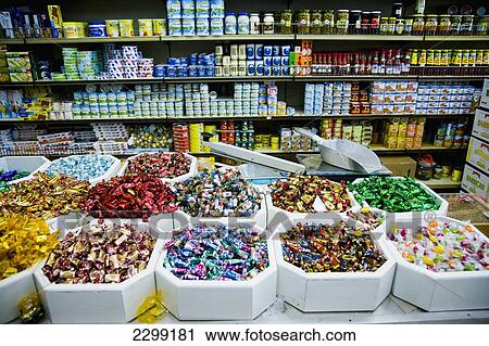 Stock Image - UAE, Al Raffa area of city centre; Dubai, Shop selling sweets and nuts. Fotosearch
