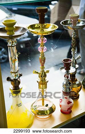 Stock Image - UAE, Al Raffa area of city centre; Dubai, Shop selling Hookah Pipes in front window. Fotosearch