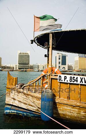 UAE, Bussling waterway traffic of Dubai Creek. Small ferries and fishing boats and private vessels crossing narrow waterway in Dubais centre. High Rise corporate buildings donimate the waterside skyline; Dubai View Large Photo Image Stock Photo - UAE, Bussling waterway traffic of Dubai Creek. Small ferries and fishing boats and private vessels crossing narrow waterway in Dubais centre. High Rise corporate buildings donimate the waterside skyline; Dubai. Fotosearch